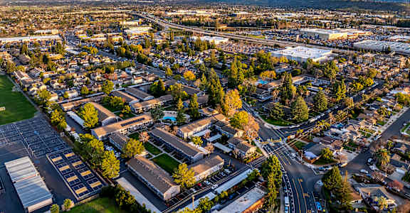 A cityscape with buildings and roads under a clear sky at Cherrywood Apartments, California, 95118