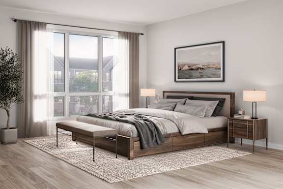 A modern bedroom with a large bed, a nightstand with a lamp, and a framed picture on the wall.