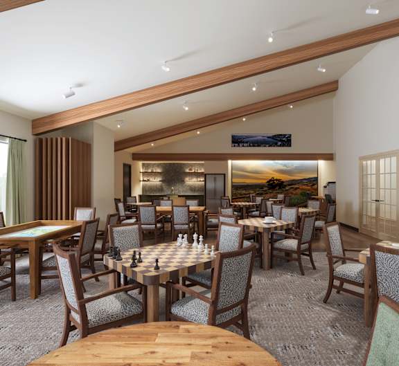 A restaurant with wooden chairs and tables.