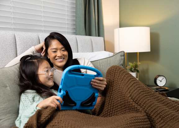 Mom and daughter playing games on computer together
