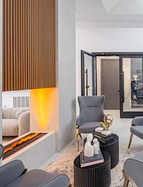a living room with a white couch and a table at The Franklin Marlboro Apartments, Marlboro, NJ 07746