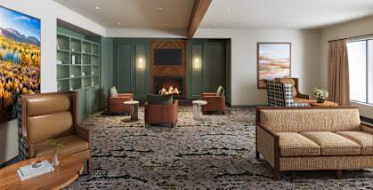 A living room with a fireplace and a couch.