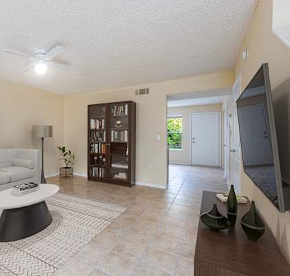 a living room with a white couch and a coffee table