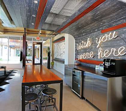 A restaurant with a neon sign at 1221 Broadway Lofts, San Antonio, 78215