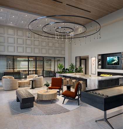 the lobby of a hotel with a lobby area and a reception desk