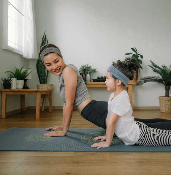 Women with a Kid Doing Yoga at Estia Roseville Apartments, Roseville, CA 95747