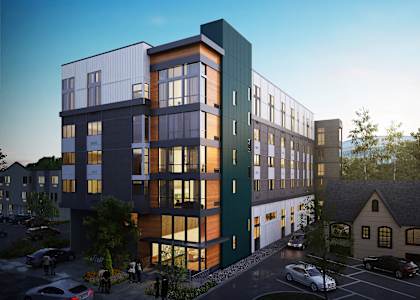 a rendering of an apartment building in the evening
