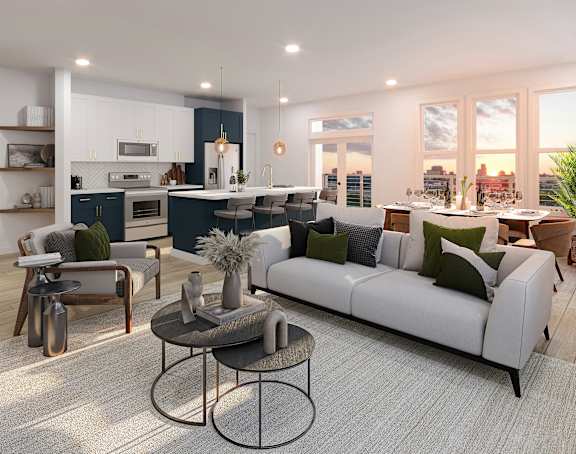 A modern living room with a white sofa and a coffee table.