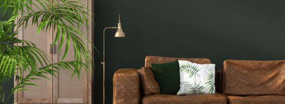 a living room with a blue couch and pillows