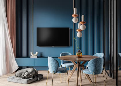 a dining room with blue walls and a table and chairs