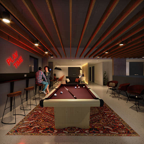 A man is playing pool in a room with a red carpet at Beton Apartments, Wembley, HA9 0SL