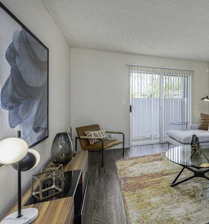 an open living room with a couch and a coffee table