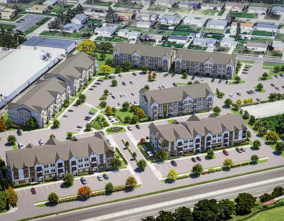 A bird's eye view of a residential area with multiple houses and a parking lot.