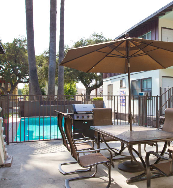 our apartments have a large back yard with a grill and bbq