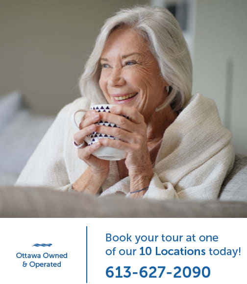 a woman in a bathrobe drinking a cup of coffee