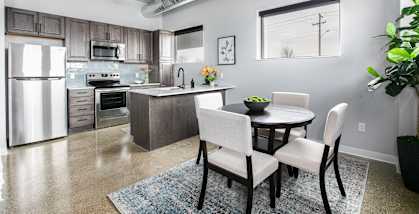 an open kitchen and dining room with a table and chairs