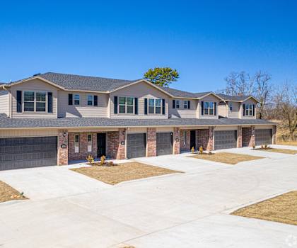a large house with a driveway in front of it