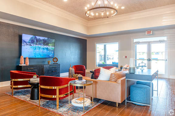 a living room with a couch and a ceiling fan at Reserve Of Bossier City Apartment Homes in Bossier City, LA