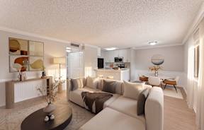 A modern living room with a large sectional sofa and a coffee table.