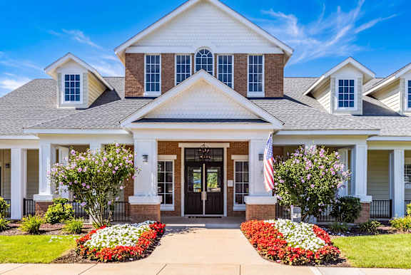 A house with a flag on the front porch.