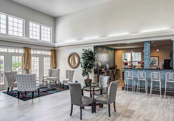A dining room with a large table and chairs at Landings at Amhurst Lake Apartments, Illinois