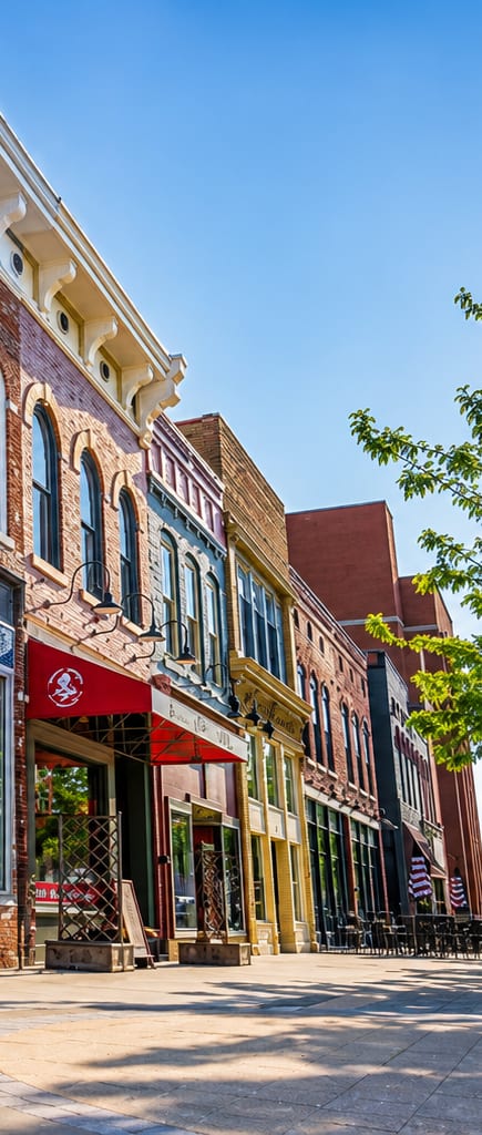 A row of buildings with a red awning on the first one.