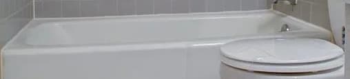 Tiled floor bathroom with subway tiled shower