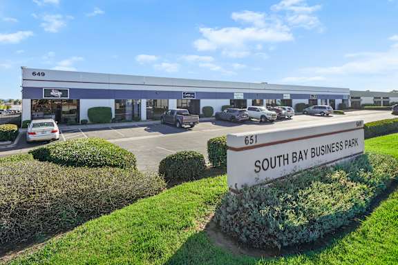 A building with the number 649 on it is part of the South Bay Business Park.