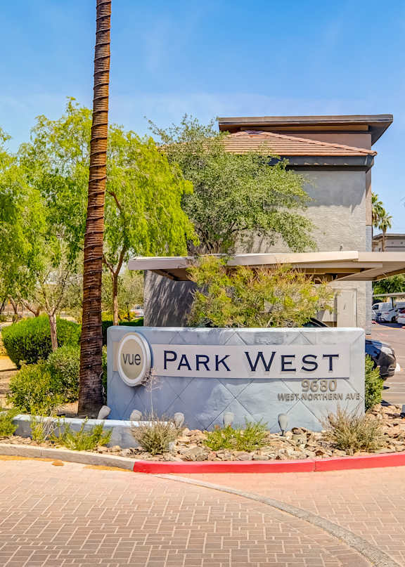 A sign for Park West is in front of a building.