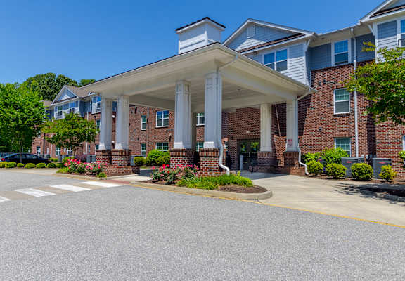 A building with a white canopy and pillars.