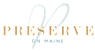 A logo with the word "PRESERVE" in gold and "MAINE" in white on a black background.