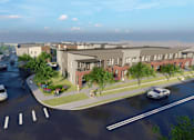 Thumbnail 7 of 8 - an aerial view of a development with cars parked in a parking lot
