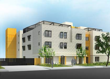 A modern building with a yellow and white facade.