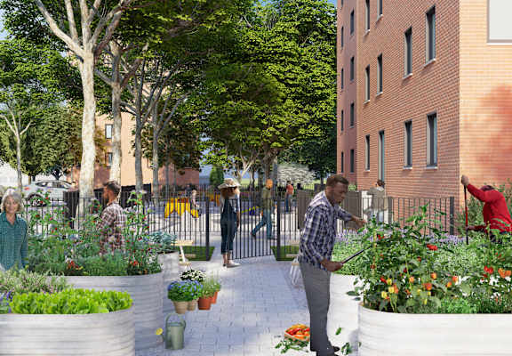 a group of people working in a garden in front of a building