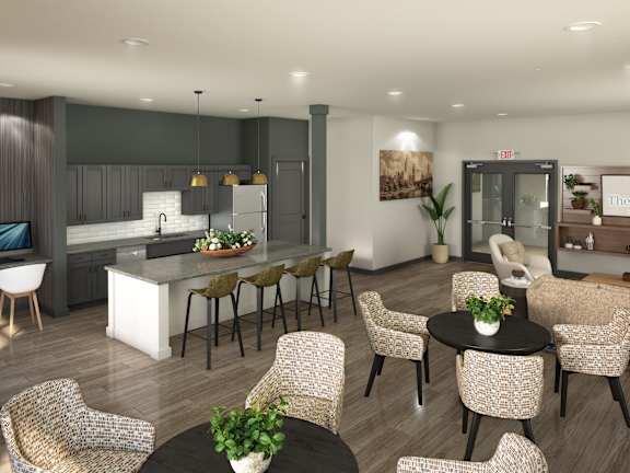 A modern living room with a kitchen area in the background.