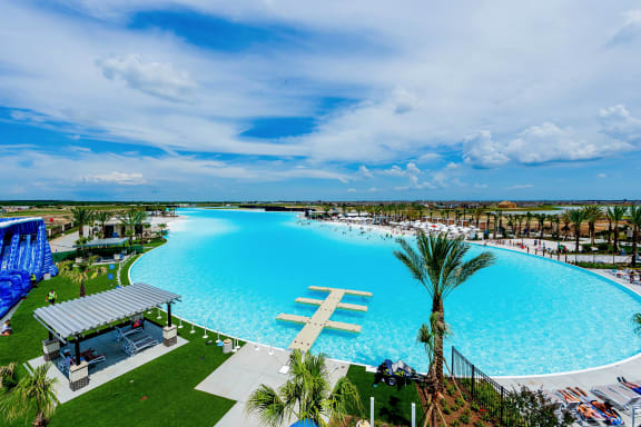 an aerial view of a large swimming pool at a resort