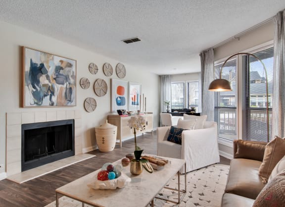 Spacious Living Room with Fireplace at Duluth Apartments Near Berkeley Lake