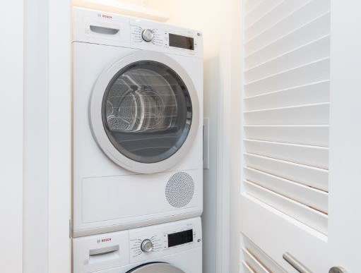 a bathroom with a toilet sink and shower