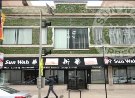 the facade of a building with a sun wax store