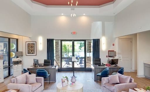 a large room with couches and chairs and a coffee table at Enclave at Breckenridge Apartments, Louisville, KY