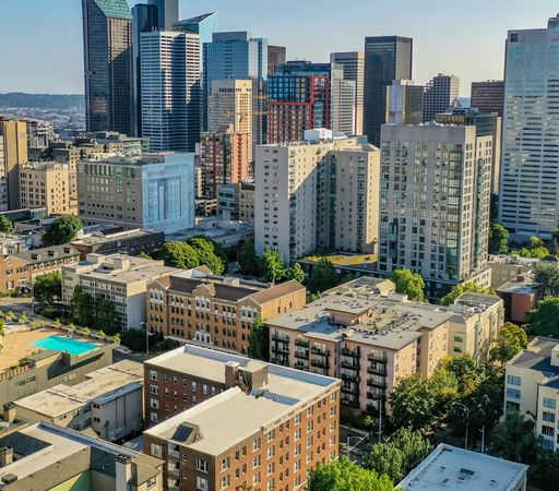 a cityscape with many tall buildings and a pool in the middle at Stockbridge Apartment Homes, Seattle, 98101