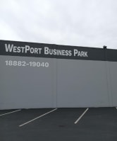 the exterior of the westport business building in the parking lot