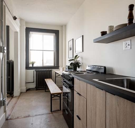 a bedroom with a bed and a door to a bathroom