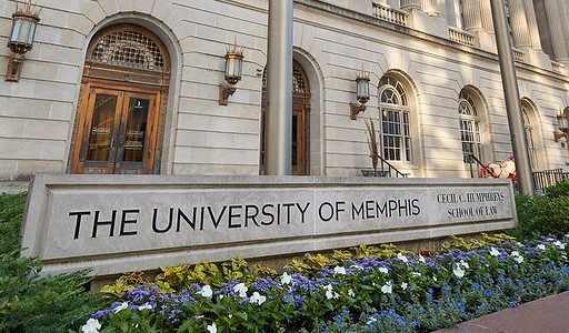 The University of Memphis sign is displayed on a building.