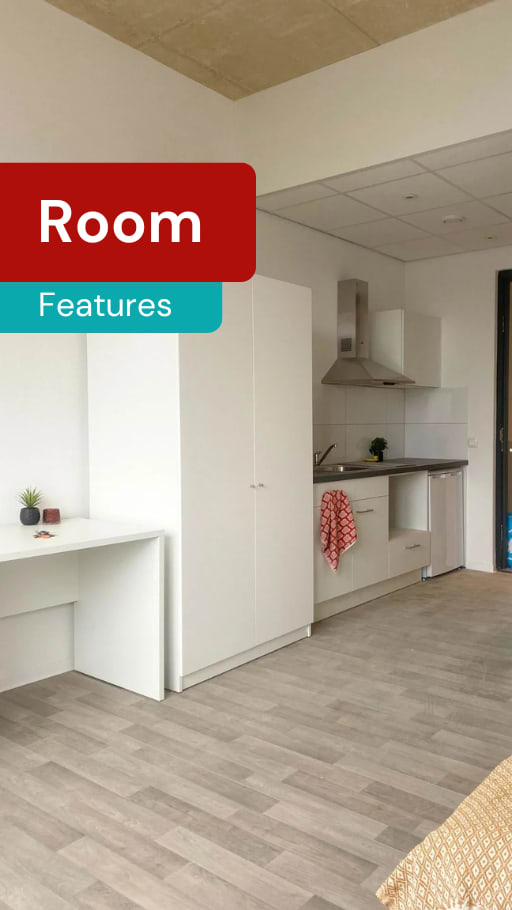 A kitchen area with a white countertop and a grey floor.