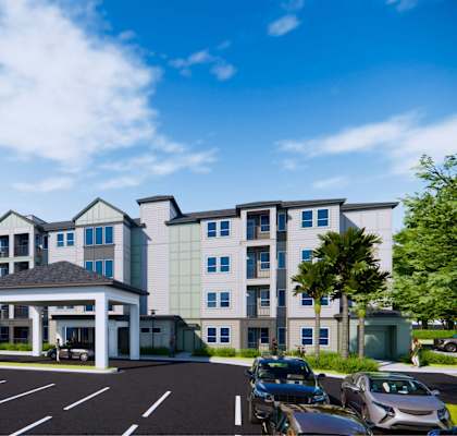 A large building with a parking lot in front of it.