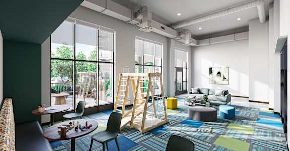 a living room filled with furniture and large windows