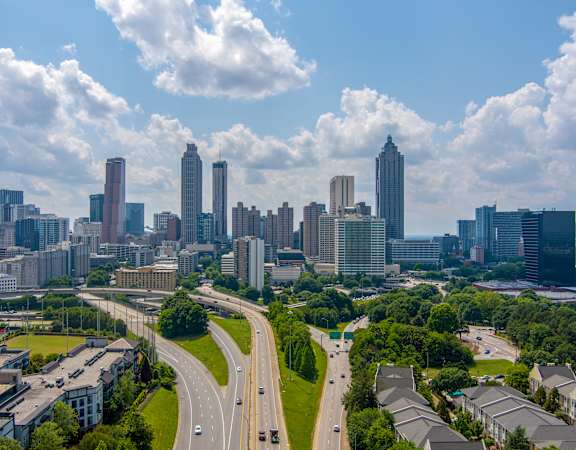 A cityscape with a highway running through it.