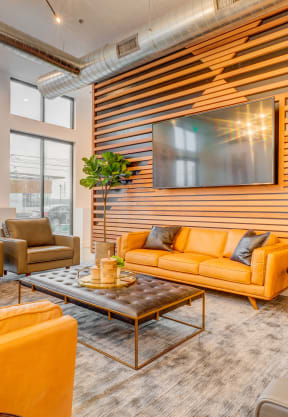 a living room with couches and chairs and a coffee table