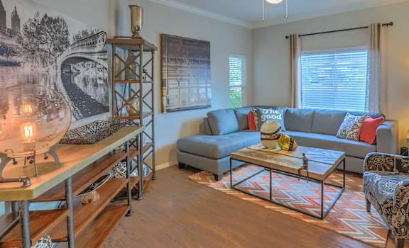 a living room with a couch and a chair at Arterra, Albuquerque